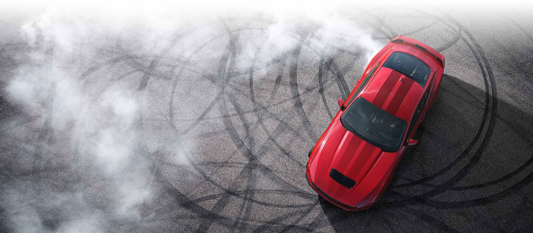 Overhead view of a 2024 Ford Mustang® model with tire tracks on pavement | Joe Hall Ford in Lewiston ID