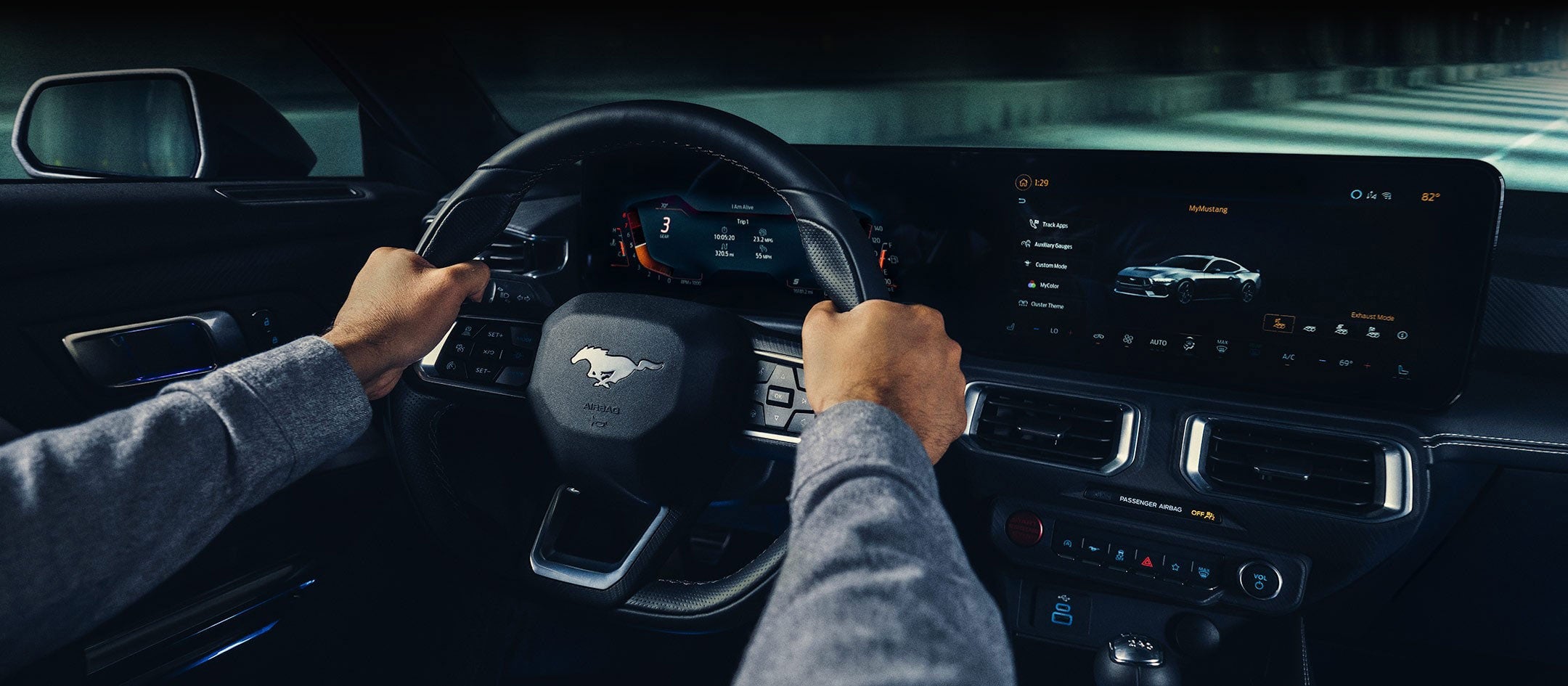 A 2024 Ford Mustang® model interior with a person driving | Joe Hall Ford in Lewiston ID