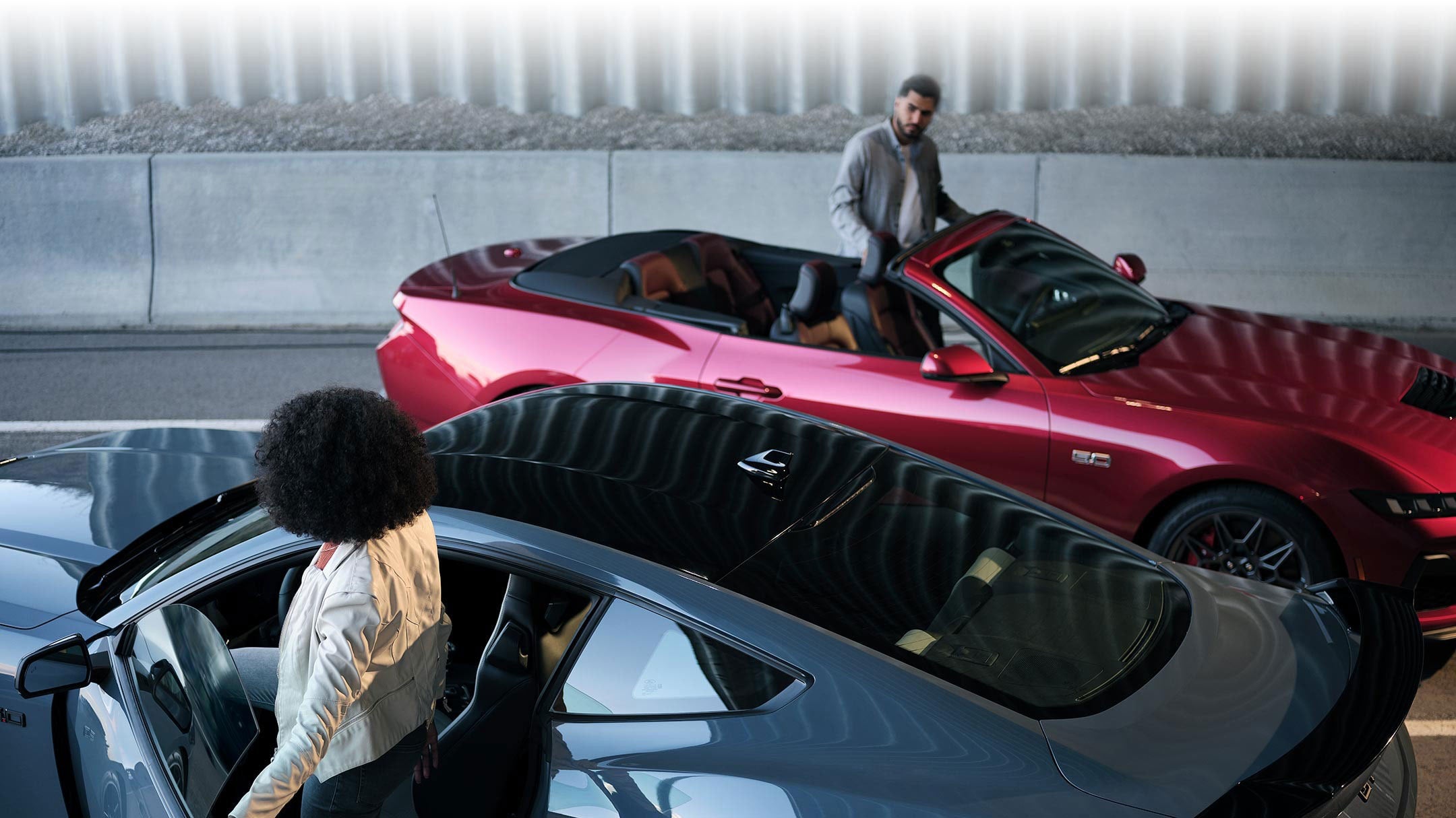 Two people exiting their parked 2024 Ford Mustang® coupe and convertible | Joe Hall Ford in Lewiston ID