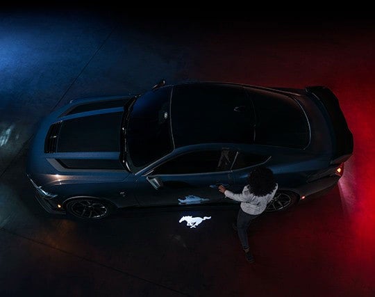 2024 Ford Mustang® Dark Horse™ model with a driver approaching the vehicle | Joe Hall Ford in Lewiston ID