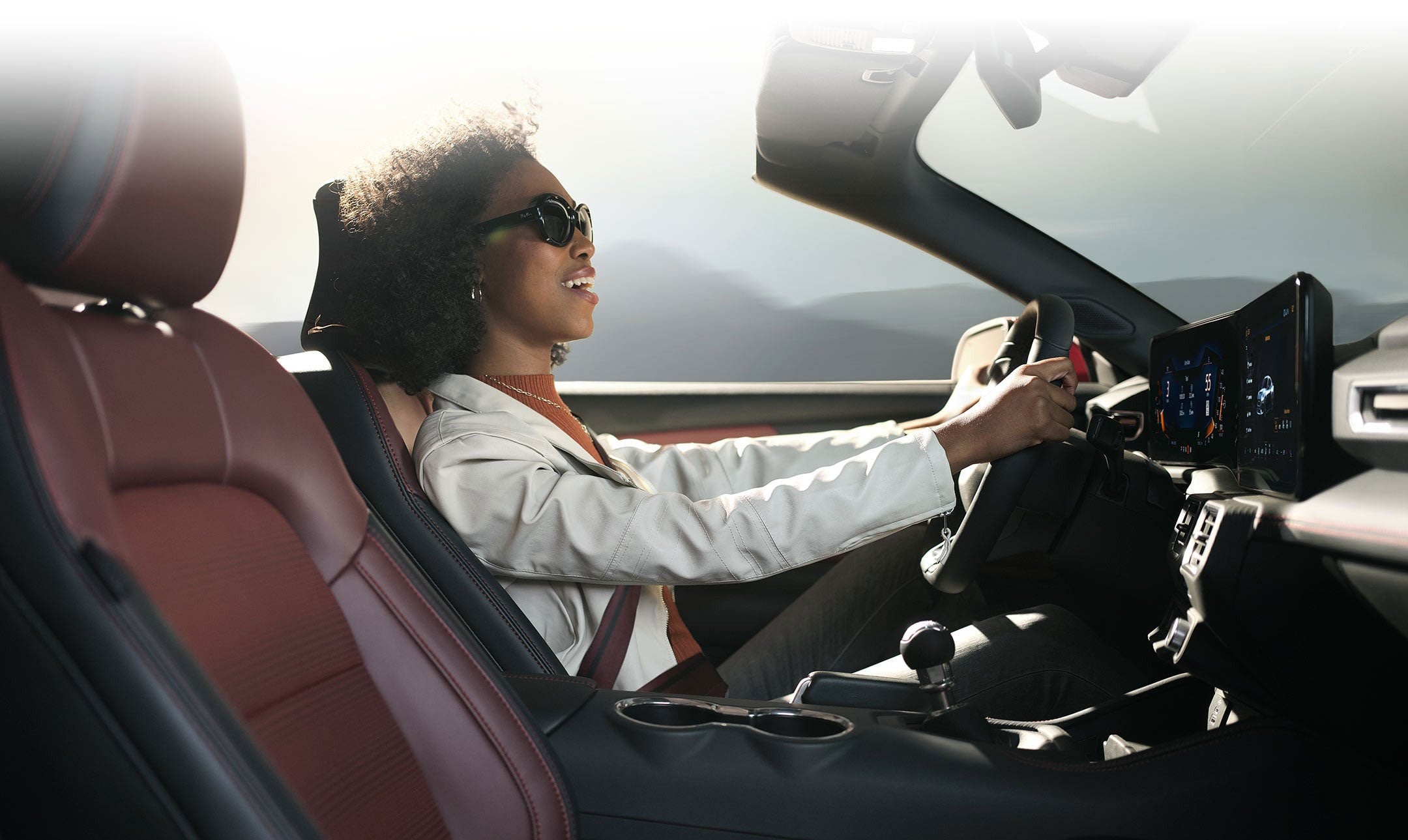 Person sitting in the driver’s seat of a 2024 Ford Mustang® convertible | Joe Hall Ford in Lewiston ID
