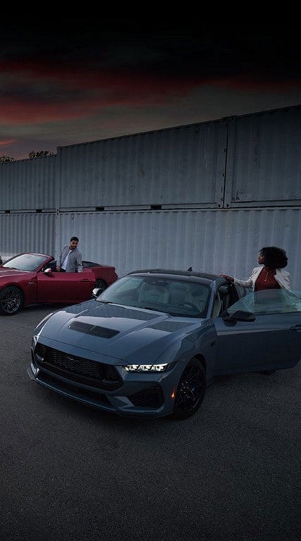 Two people exiting their parked 2024 Ford Mustang® coupe and convertible | Joe Hall Ford in Lewiston ID