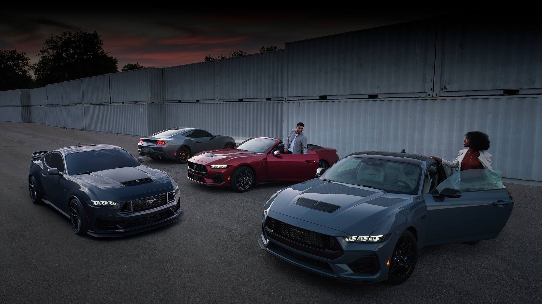 Two people exiting their parked 2024 Ford Mustang® coupe and convertible | Joe Hall Ford in Lewiston ID